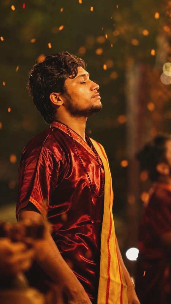 Priest in devotion during Ganga Aarti ceremony